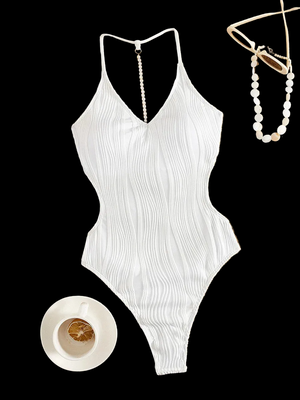 Maillot de bain femme une pièce échancré dos nu blanc Guappaa avec liserets horizontaux plissés