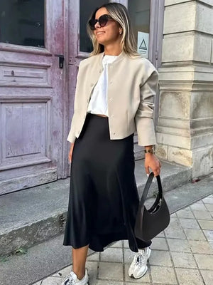 Jupe Le Reflet Serein à pois avec longueur midi et fini satiné