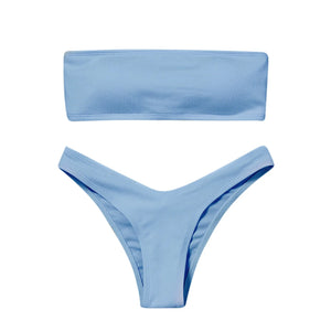 Bikini Cala Brisa violet avec haut bandeau et bas taille basse proposé dans la gamme Guappaa