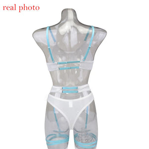 Lingerie blanche femme avec bretelles bleues sur mannequin transparent, collection GUAPPAA