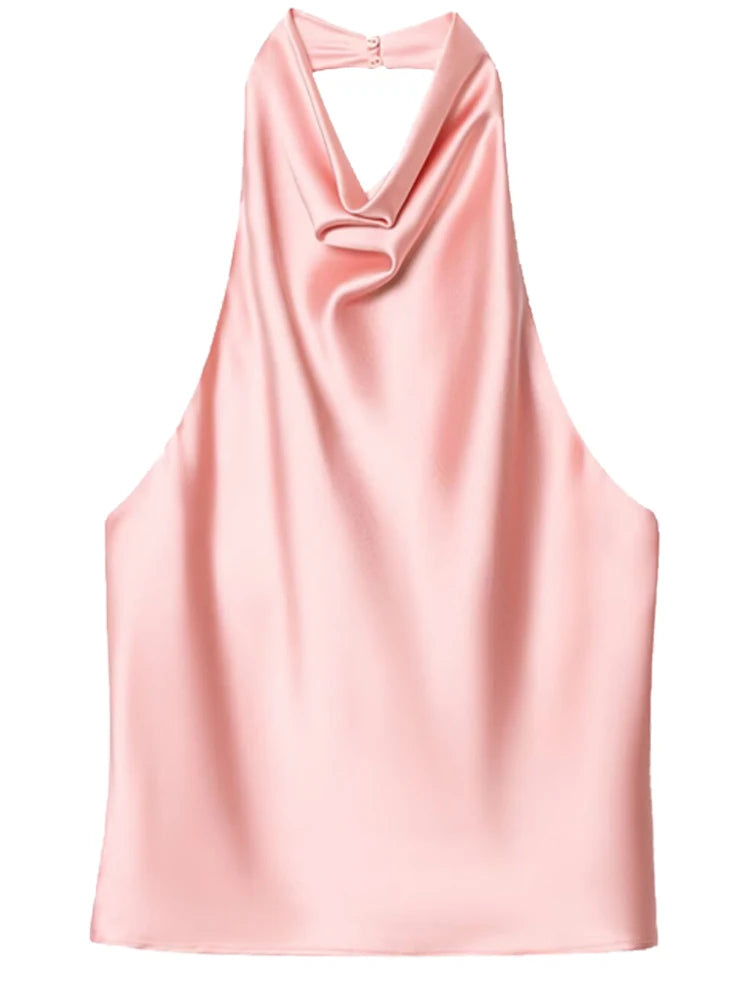 Top satiné Le Reflet Libre porté avec pantalon