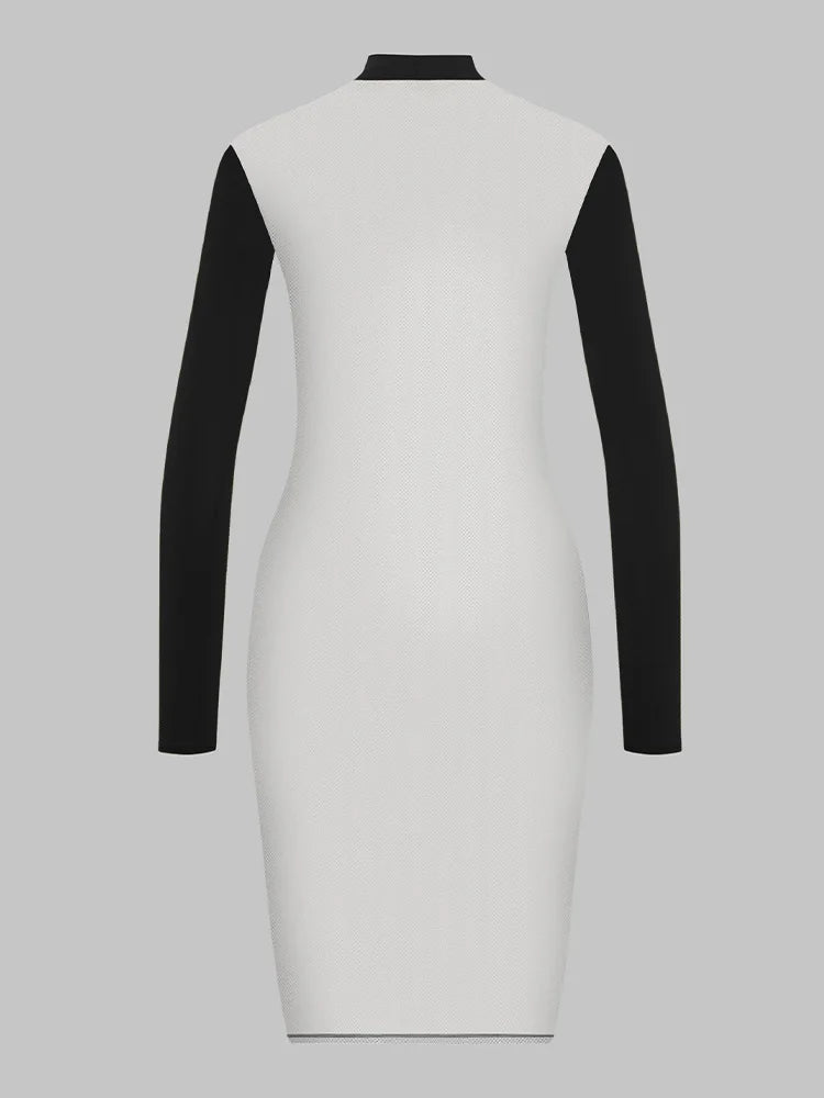 Robe noire La Ligne Sombre, détail de la coupe près du corps et des manches longues
