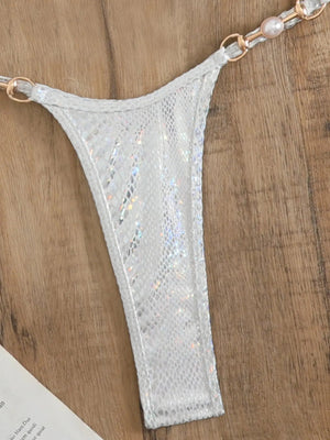 Détail du bas string argent holographique et de ses perles La Sélénite