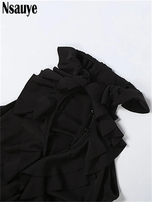 Robe noire courte La Vague Noire Guappaa en maille extensible pensée pour les soirées d’été